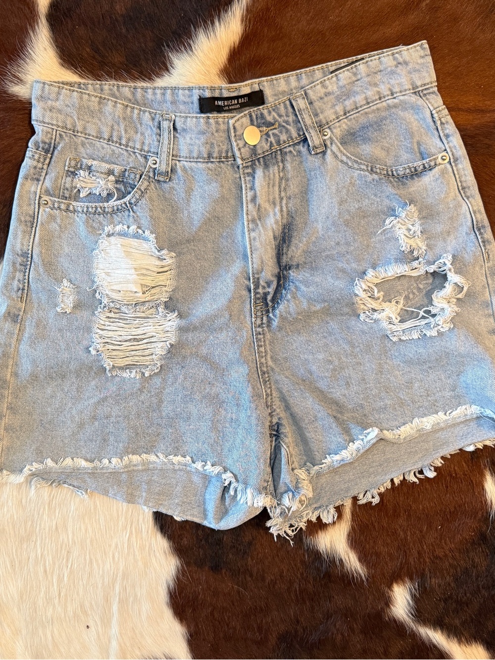 Women’s Light Blue Distressed Denim Shorts